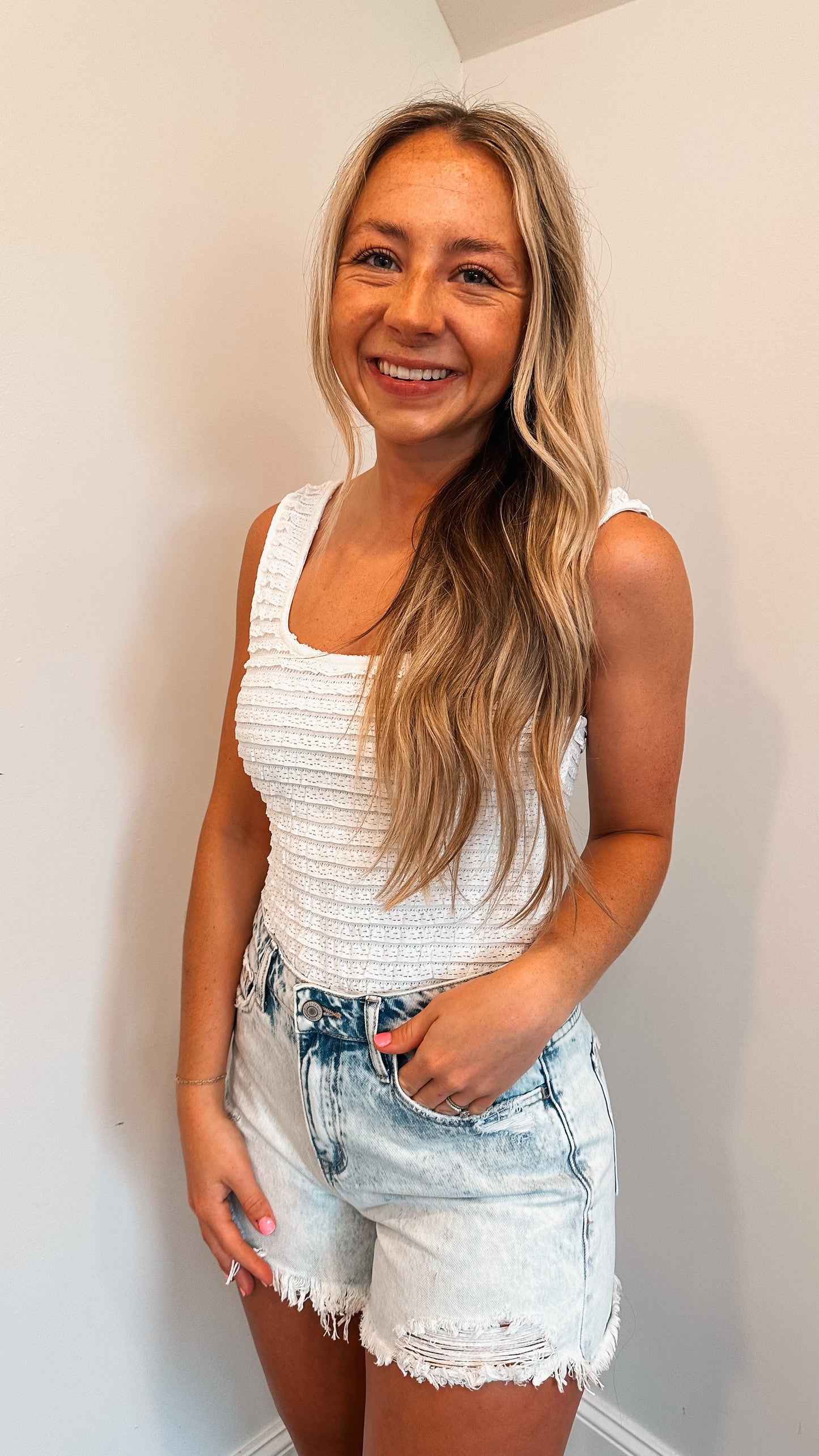 white ruffle bodysuit